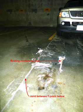 The worst leak, above, is also damaging the slab below. Cracking along the T-Joist and exposed rebar--see plan for location